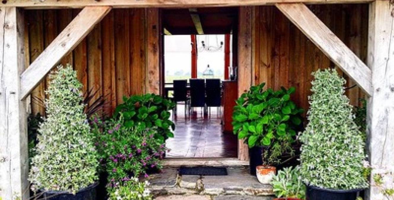 stone porch oak door front entrance to Barn